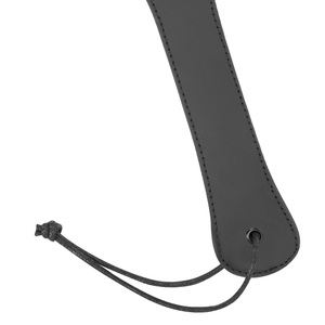 Detail shot of a vegan leather paddle for BDSM in black