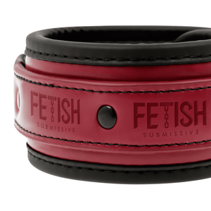 Detail shot of a BDSM ankle cuffs made from vegan leather in red and black colour