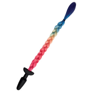 A black butt plug with a tail in rainbow colors