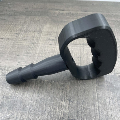 Een adapter voor vac-u-lock seks toys met een zwarte handgreep.