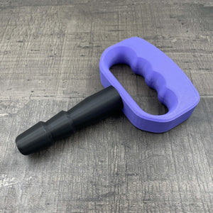 Een adapter voor vac-u-lock seks toys met een paarse handgreep.