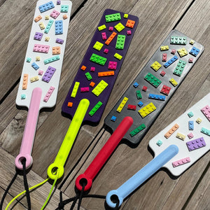 4 BDSM paddles met bouwstenen in verschillende kleuren