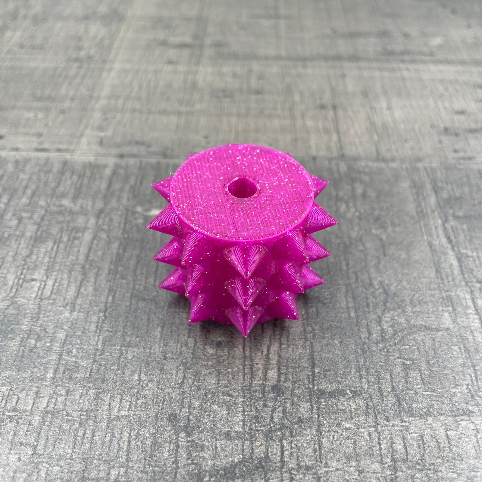 Een los rollertje voor een BDSM pinwheel in magenta met glitter