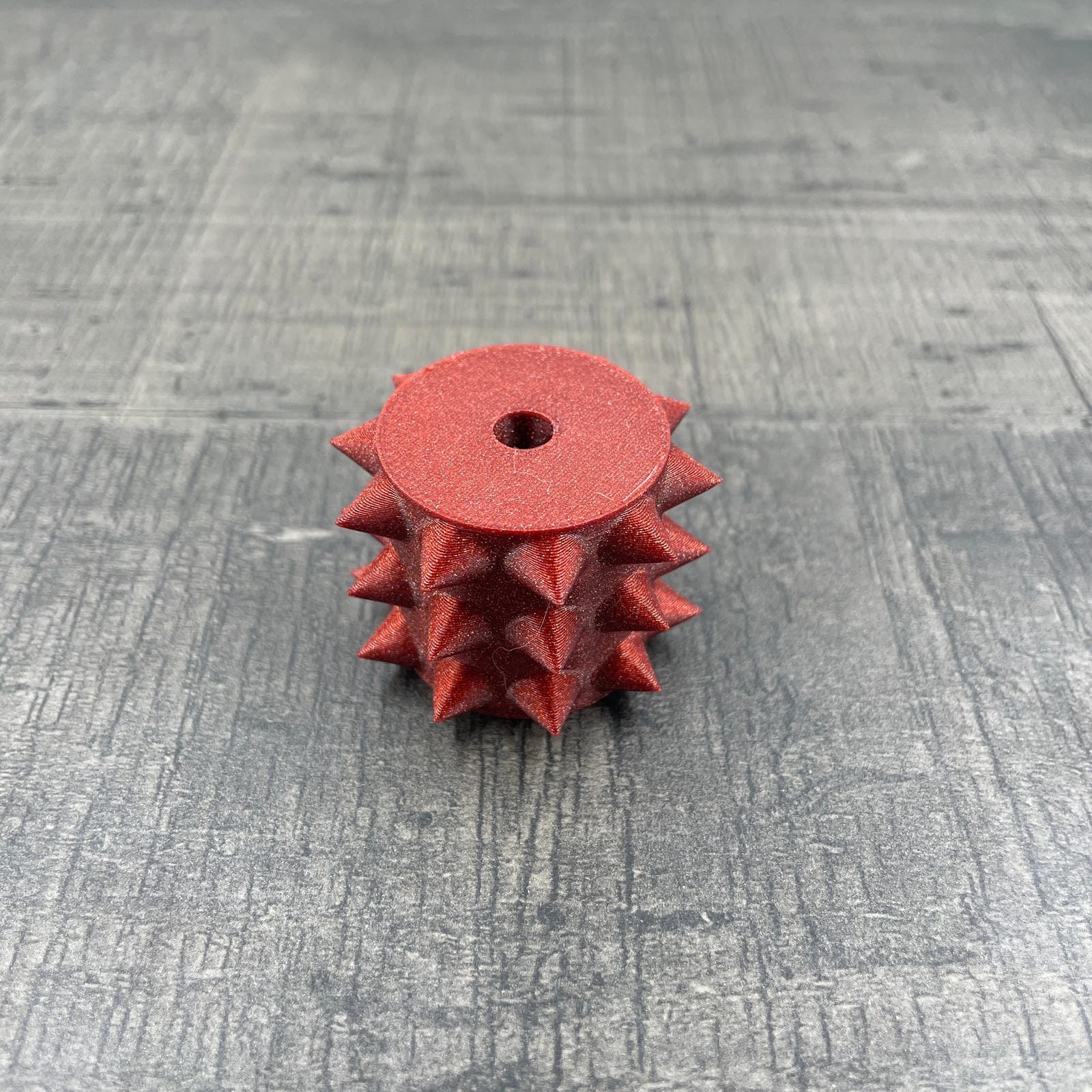 Een los rollertje voor een BDSM pinwheel in het rood met glitters