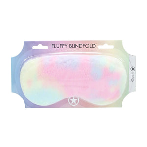 A fluffy blindfold with rainbow colours in it's packaging