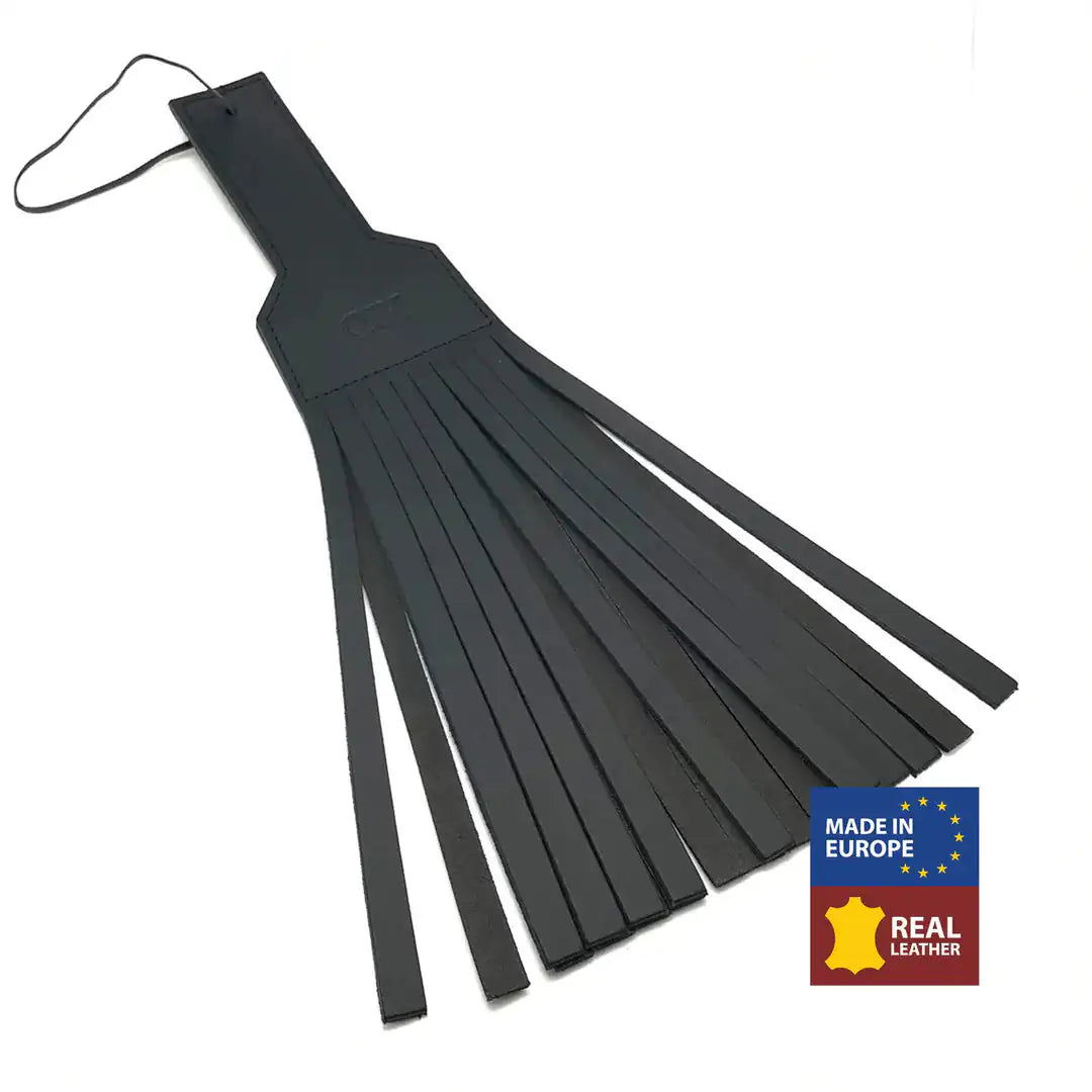 A leather BDSM paddle with multiple straps