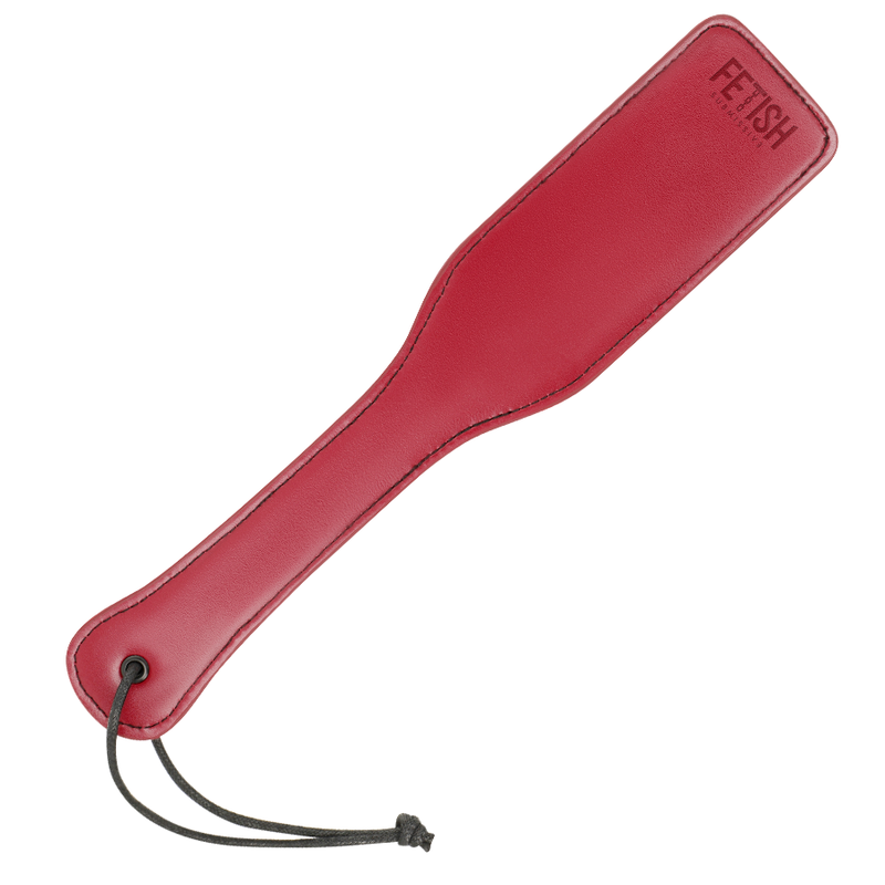 A vegan leather paddle for BDSM in red